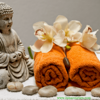 orange towels with buddha and flowers